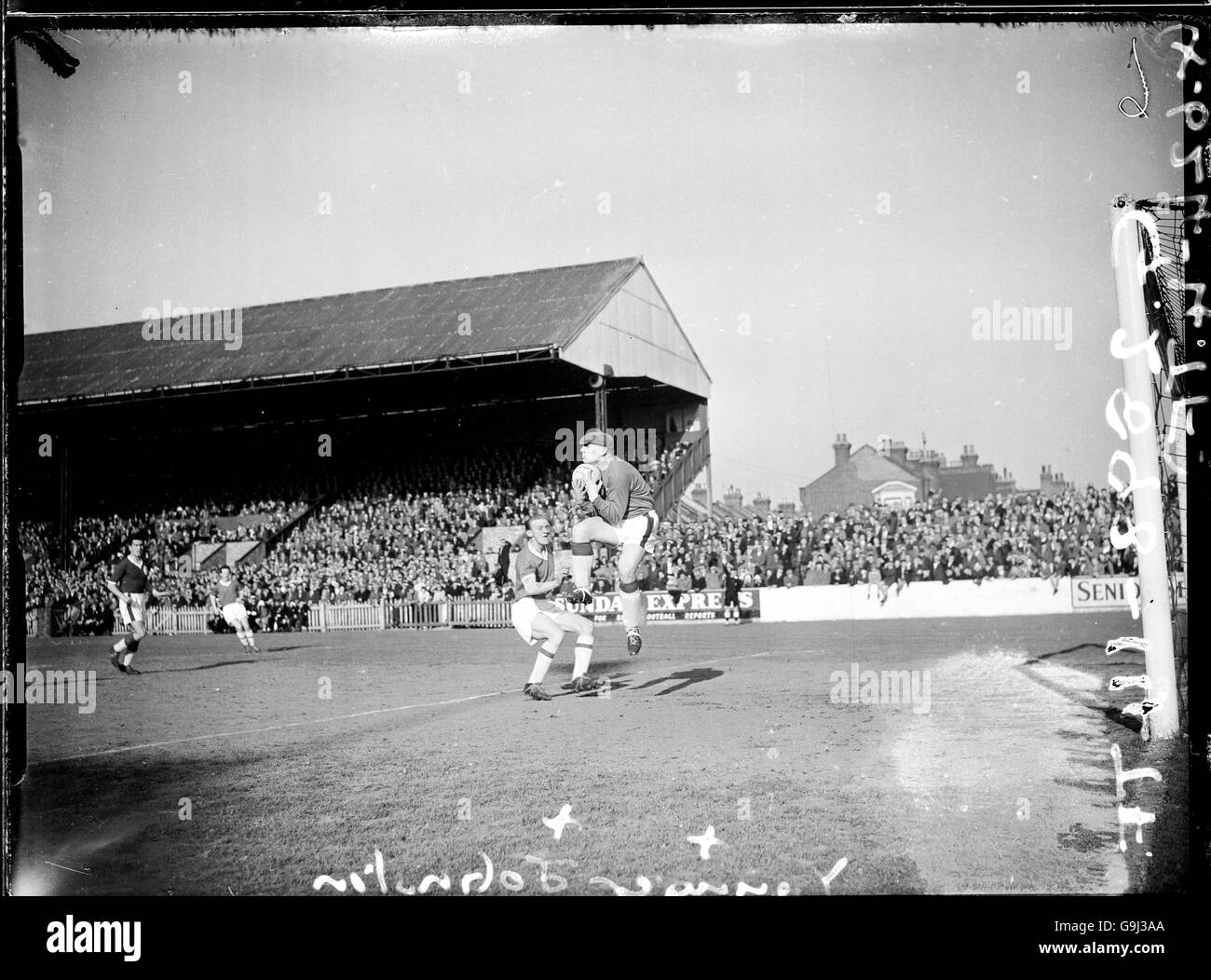Soccer - Football League Division Two - Leyton Orient v Liverpool. Liverpool goalkeeper Tommy Younger (r) catches the ball under pressure from Leyton Orient's Tom Johnston (l) Stock Photo
