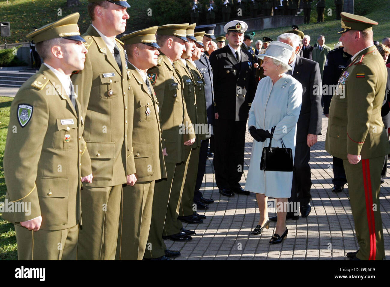 Britain's Queen Elizabeth II meets soldiers from the Lithuanian Army who have served in Afghanistan, at the Antakalnis Cemetery in Vilnius, during a state visit to Lithuania. Stock Photo