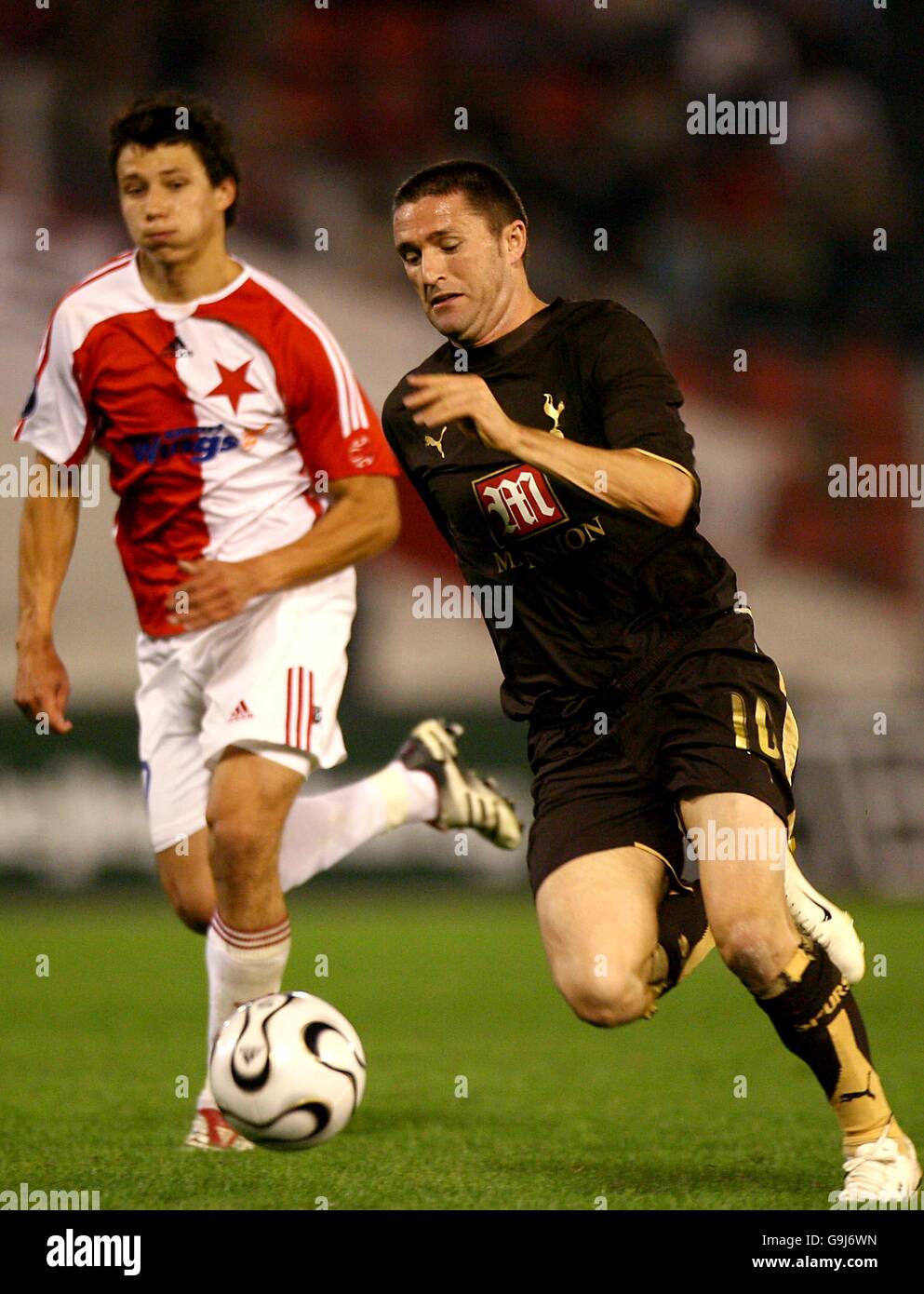 Tottenham Hotspur's Robbie Keane is tracked by Slavia Prague's Marek Suchy Stock Photo