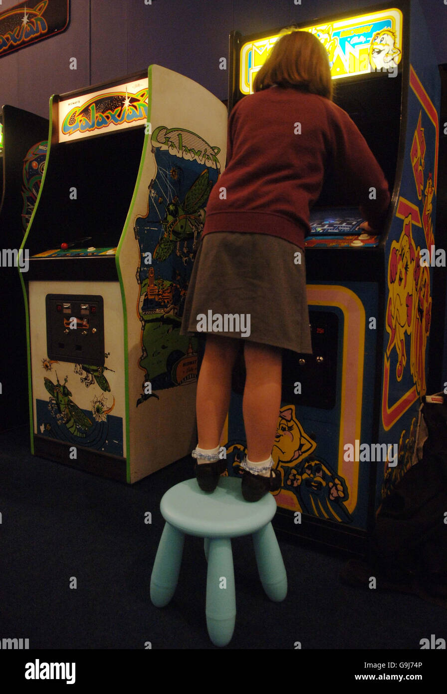 A visitor to the 'Game On' exhibition at the Science Museum in London plays a computer game which forms part of an exhibition of arcade and computer games dating from 1962 to the present day. Stock Photo