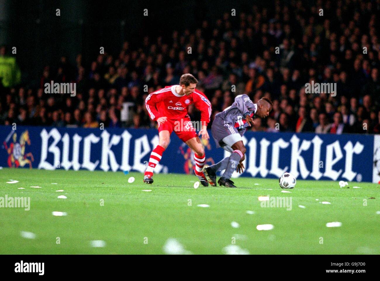Olympique Lyonnais's Sidney Govou (r) turns away from Bayern Munich's Thomas Linke (l) Stock Photo