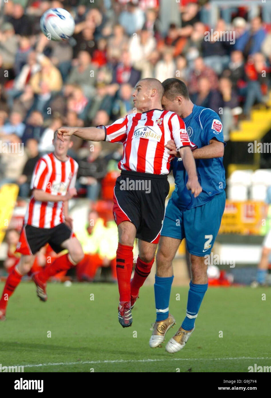 Lincoln's Jamie Forrester (left) and Rochdale's Simon Ramsden during the Coca-Cola Division Two match at Sincil Bank, Lincoln. Stock Photo