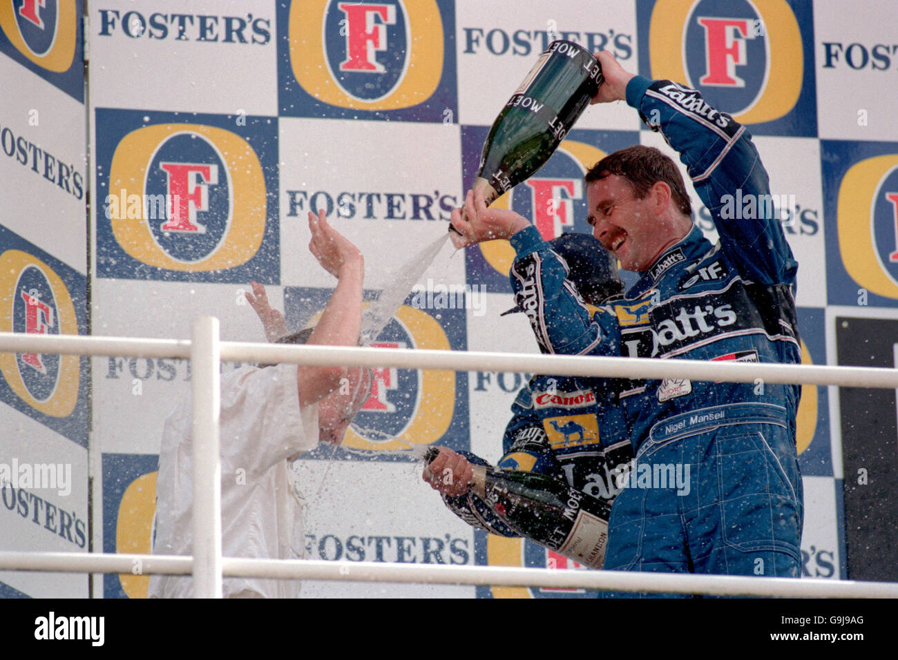 Formula One Motor Racing - British Grand Prix 1992 - Silverstone. Nigel Mansell celebrates with champagne after winning his home Grand Prix Stock Photo