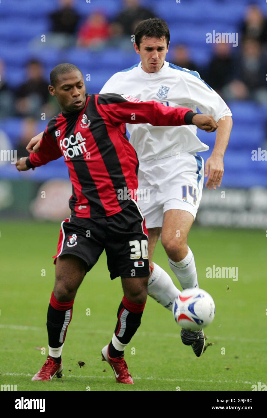 Tranmere's John Thompson (right) and Bournemouth's Franck Songo'o battle for the ball during the Coca-Cola League One match at Prenton Park, Birkenhead. Stock Photo