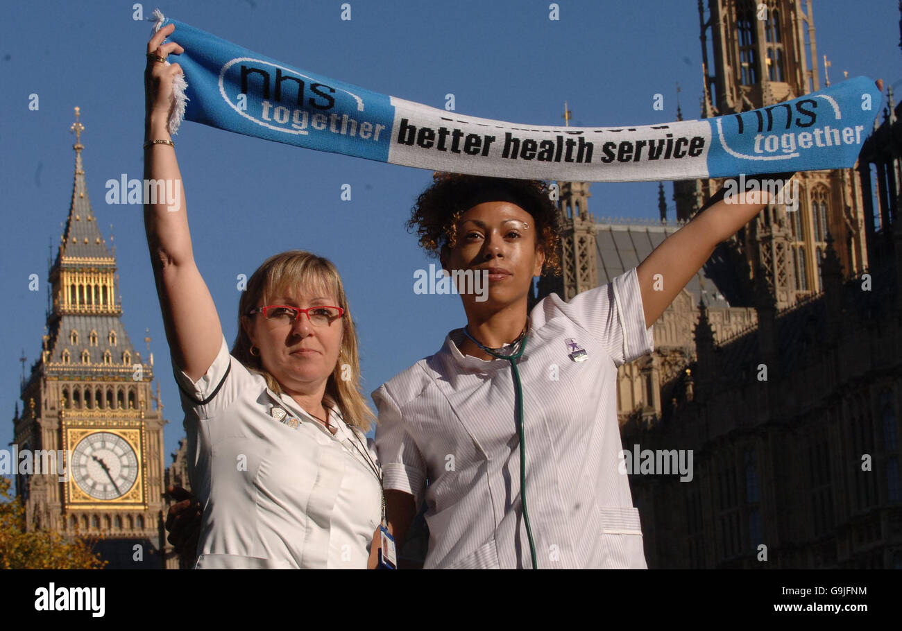 Rosie Auld, Head Orthoptist from Birmingham Eye Hospital and Sam Selon a Psychiatric Nurse from Charing Cross Hospital, demonstrate outside the House of Commons in London. Stock Photo