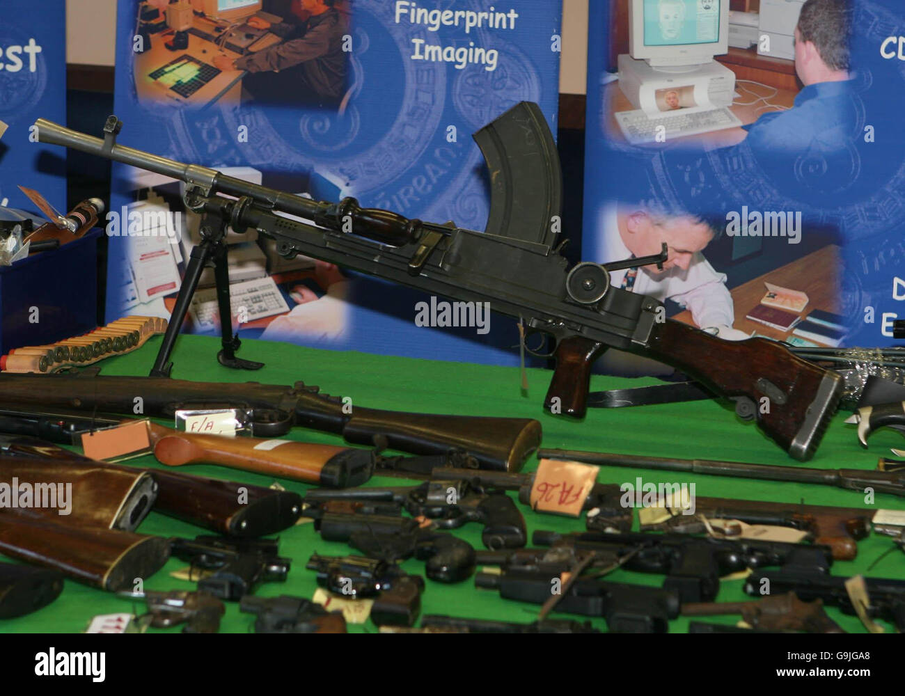 A BREN second world war machine gun sits among a selection of guns on
