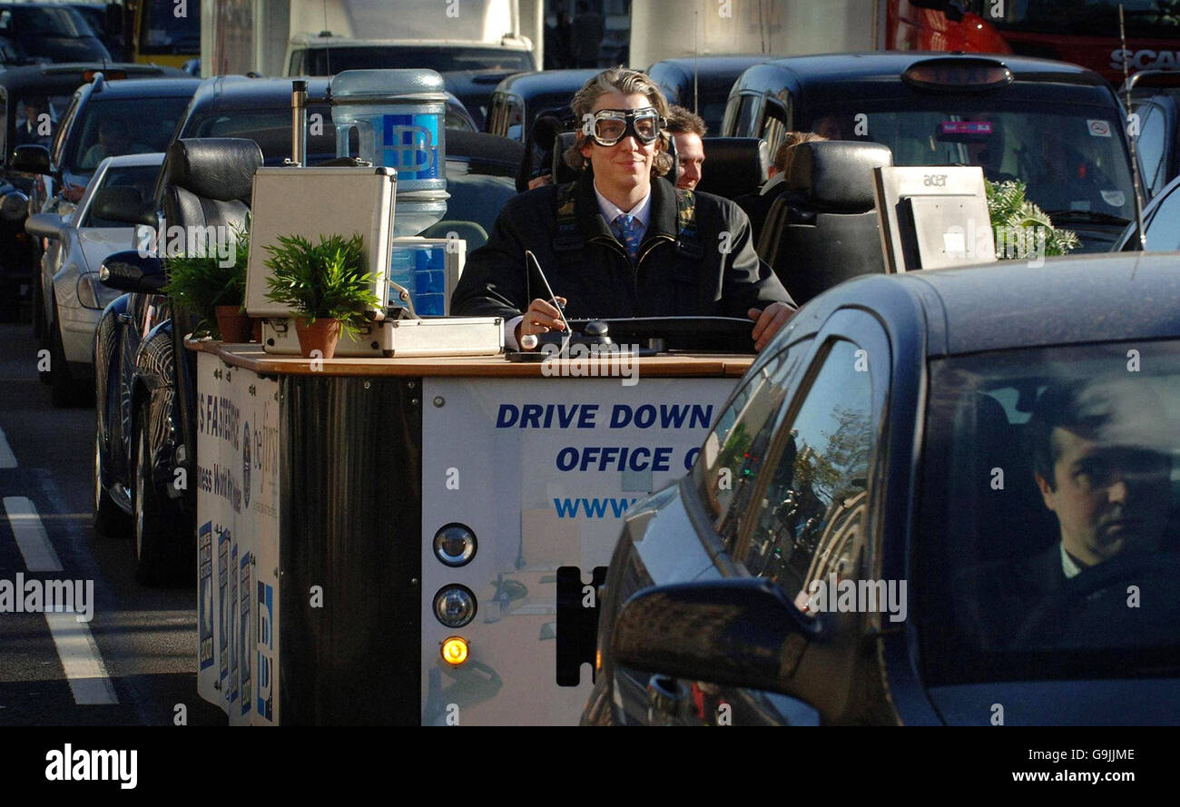 Edd China attempts to break the world record for the fastest motorised office across Westminster Bridge in central London as part of Guinness World Records Day. Stock Photo