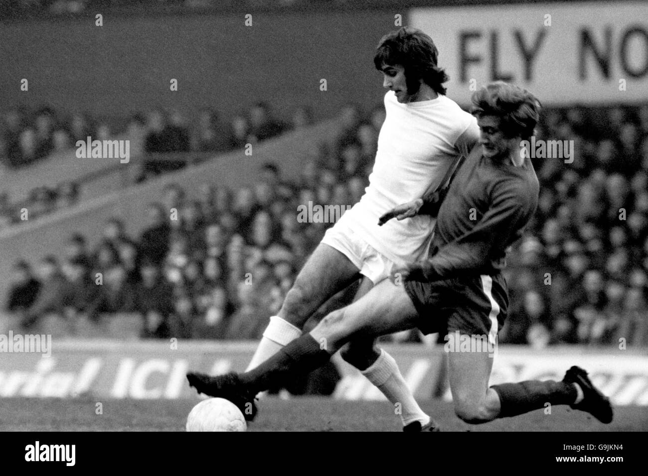 Soccer - FA Cup - Quarter Final - Middlesbrough v Manchester United. Manchester United's George Best is tackled by Middlesbrough's Bill Gates Stock Photo