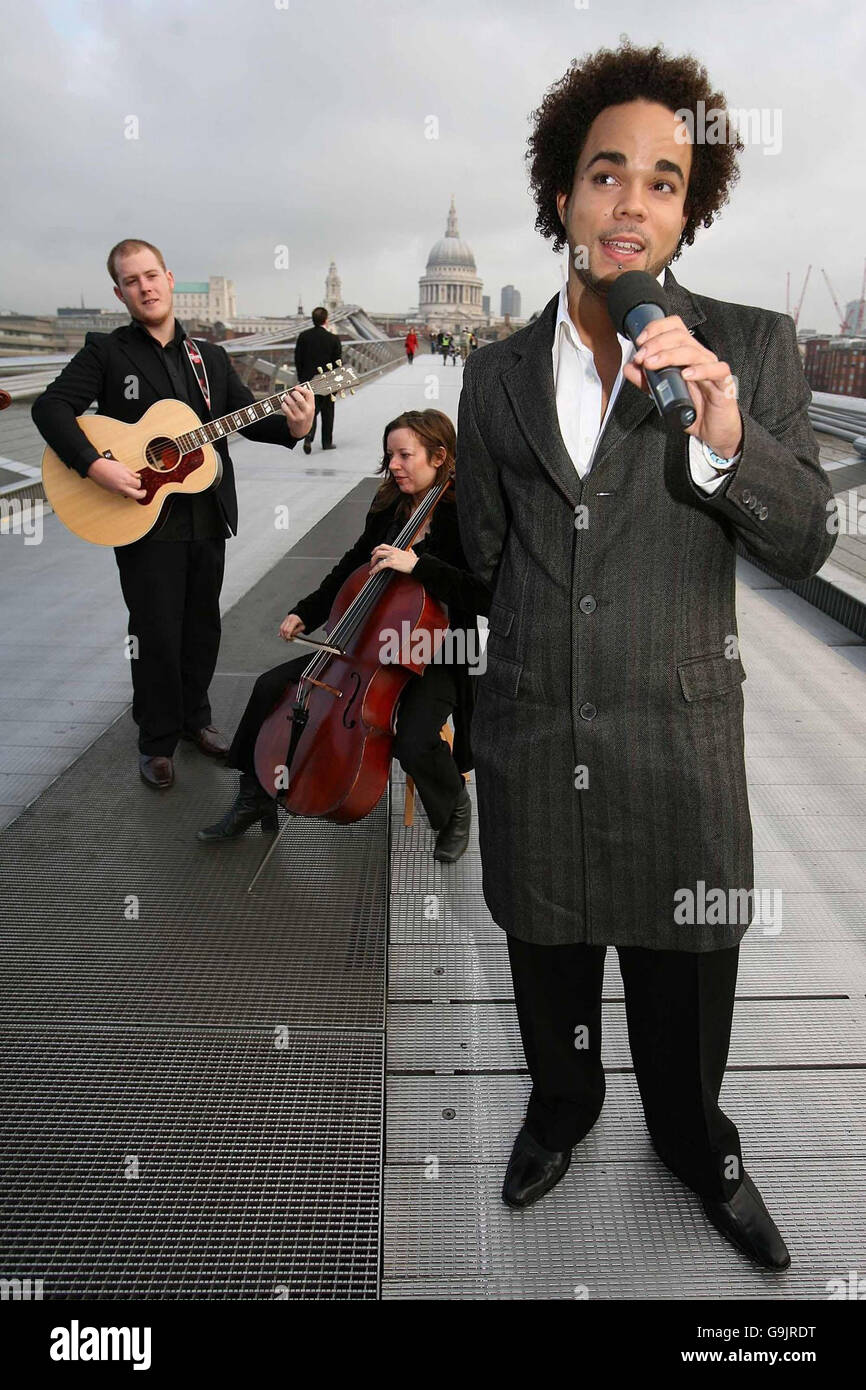 Soul singer and songwriter Nate James (right) performs with members of the Philharmonia Orchestra to launch the BT Groove Search Competition, which will attempt to find Britain's next top songwriter, on the Millennium Bridge in central London. Stock Photo