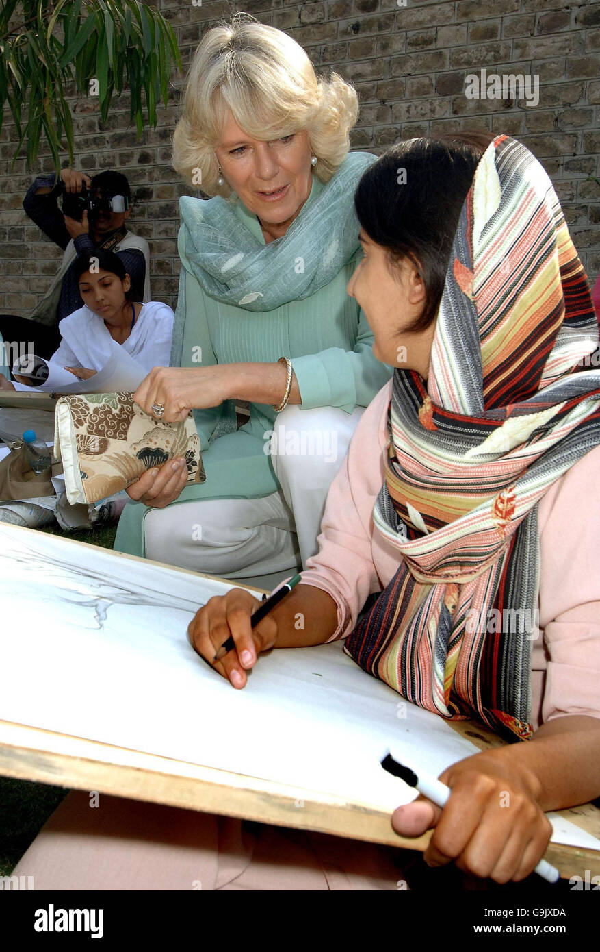 The Duchess of Cornwall talks to a student at the Fatima Jinnah college in Rawalpindi, Pakistan. Stock Photo