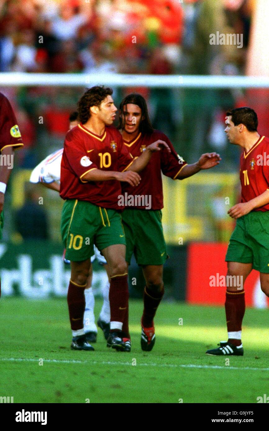 (L-R) Portugal's Manuel Rui Costa, Nuno Gomes and Sergio Conceicao celebrate the opening goal Stock Photo