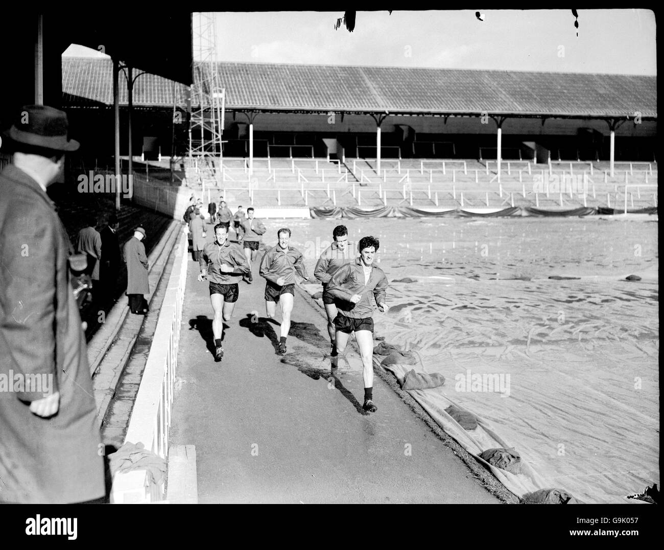 Rangers players run laps around the White Hart Lane running track Stock Photo