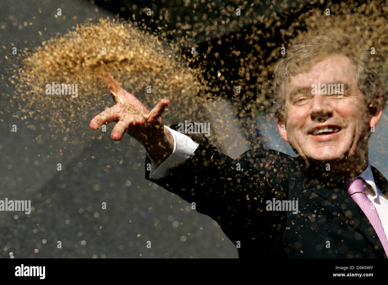 Chancellor Gordon Brown official opens the fifth Maggie's Cancer Caring Centre at Victoria Hospital in Kirkcaldy, by throwing seeds to the ground in the garden. Stock Photo