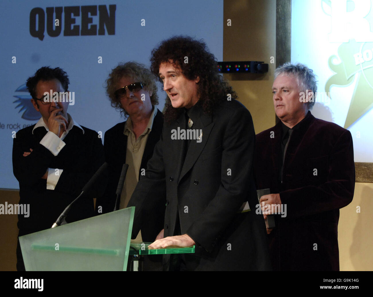 Brian May (second right) and Roger Taylor (right) of Queen accept their 'Classic Songwriter ' award, which was presented by Ian Hunter (second left) of Mott The Hoople, at the Classic Rock Roll of Honour Awards at the Langham Hotel in central London. Stock Photo