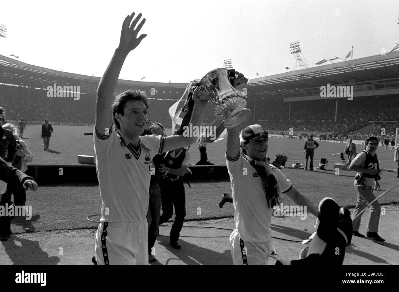 (L-R) West Ham United's Alvin Martin and Paul Allen show the FA Cup to the fans Stock Photo