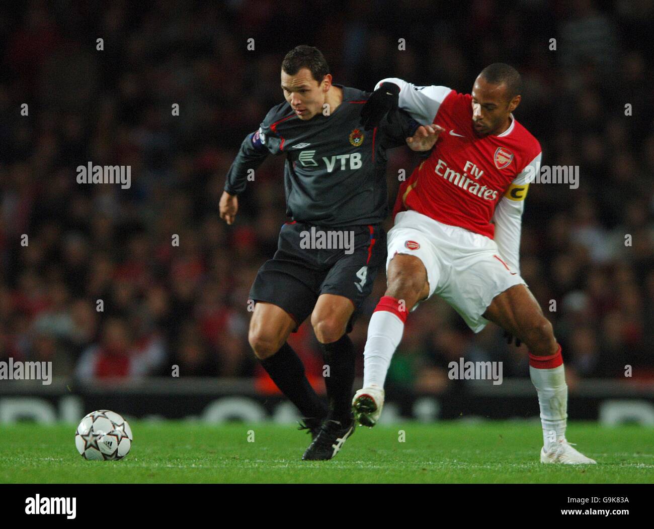 Soccer - UEFA Champions League - Group G - Arsenal v CSKA Moscow - Emirates Stadium. Arsenal's Thierry Henry is fouled by CSKA Moscow's Sergei Ignashevich as they battle for the ball Stock Photo