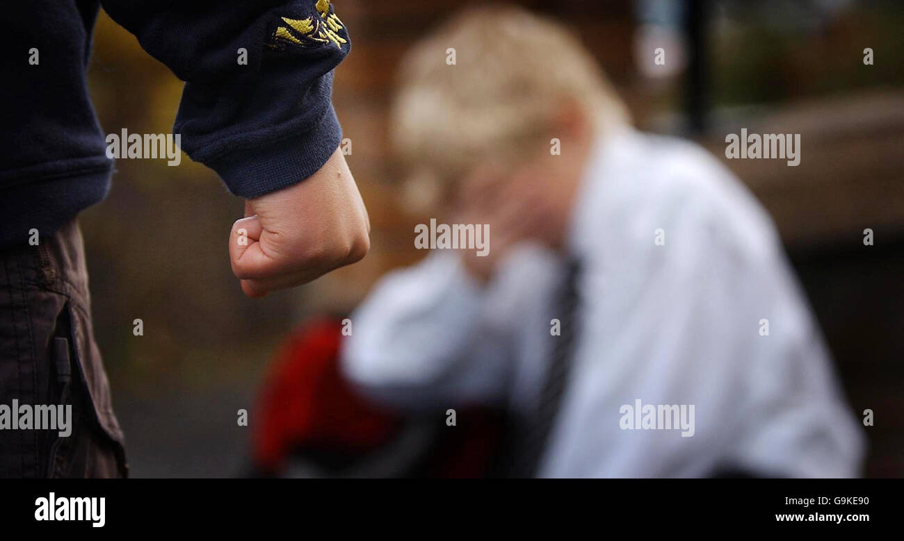Stock Bullying. Posed photograph simulating a child being bullied. Stock Photo