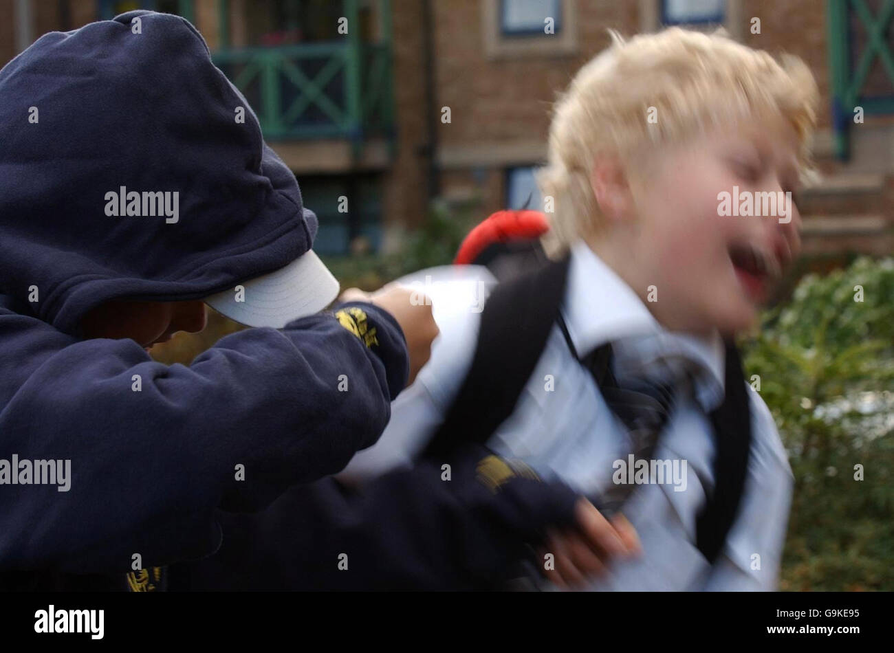 Posed photograph simulating a child being bullied. Stock Photo