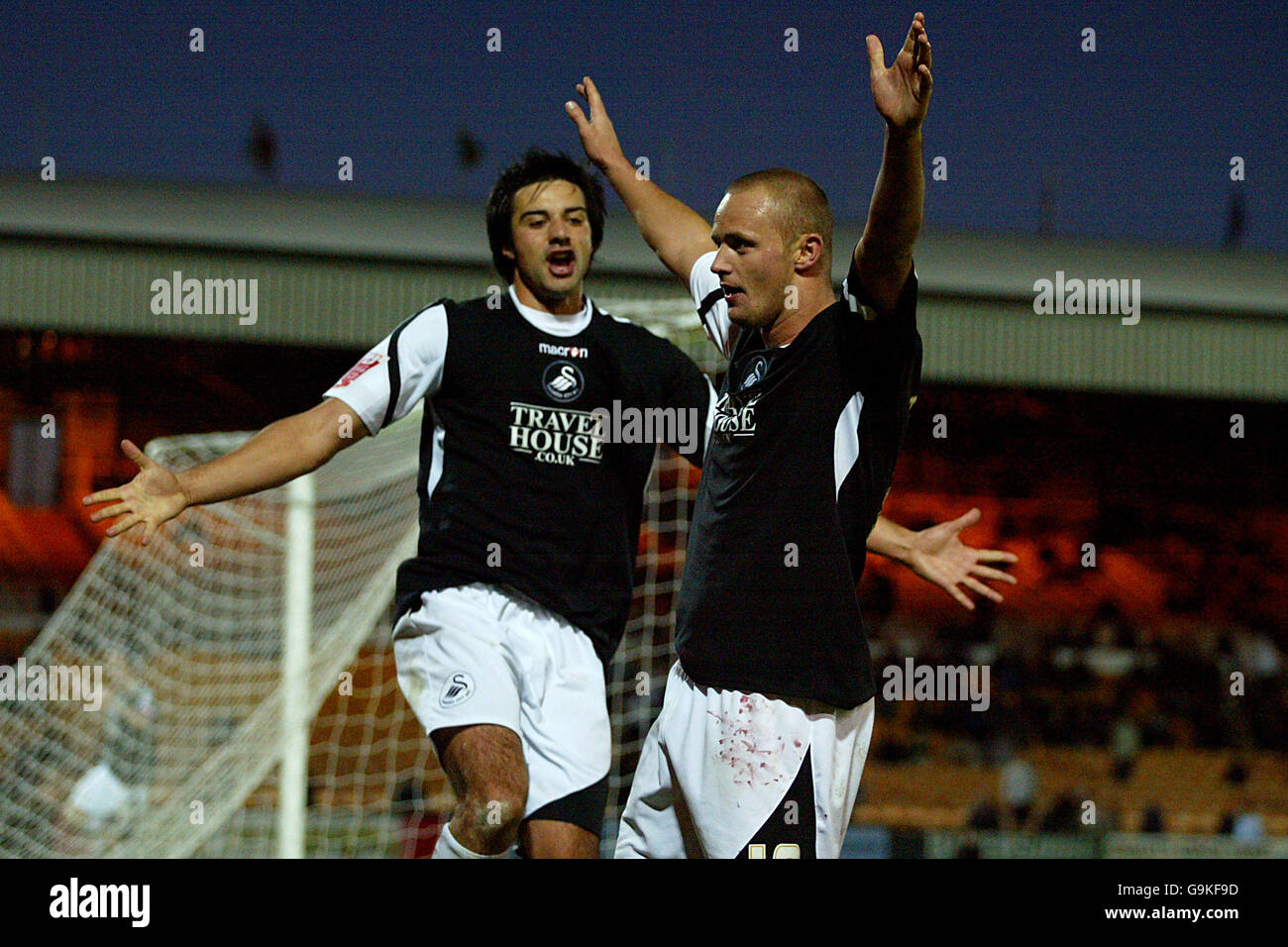 Soccer - Coca-Cola League One - Port Vale v Swansea City - Vale Park. Swansea's Lee Trundle celebrates scoring the first goal of the game with Rory Fallon Stock Photo