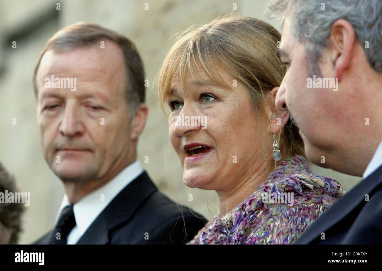 Julie Maddison (with Les Towell Left former husband and father of Christopher and right Tony Maddison her husband) speaking on the steps of Oxford Coroner's Court after the inquest into her son Royal Marine Christopher Maddison's death near Basra in Iraq 44 months ago. Stock Photo