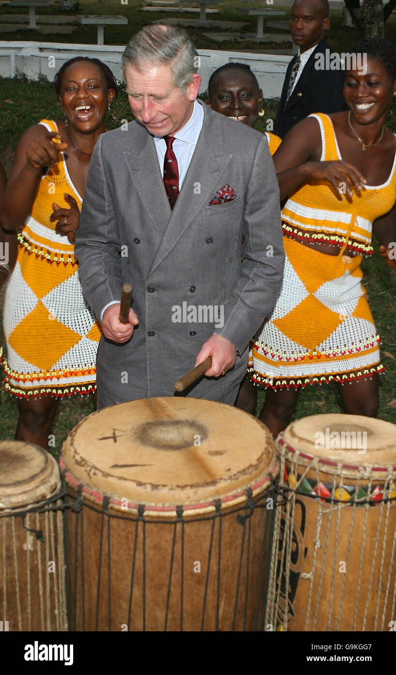 The Prince of Wales joins in with the Sierra Leone national troup band by playing the drums at Freetown golf club in Sierra Leone on the first day of his West African tour. Stock Photo
