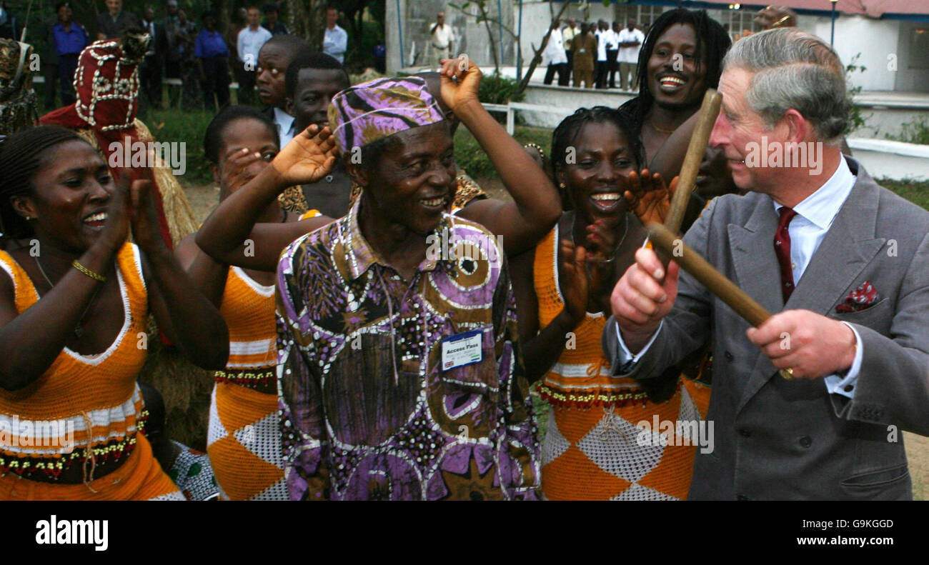 The Prince of Wales joins in with the Sierra Leone national troup band by playing the drums at Freetown golf club in Sierra Leone on the first day of his West African tour. Stock Photo