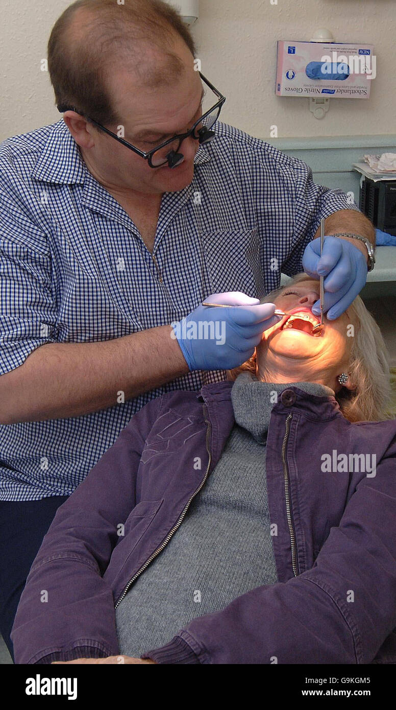 Checking condition of teeth with a visit to the dentist. Stock Photo