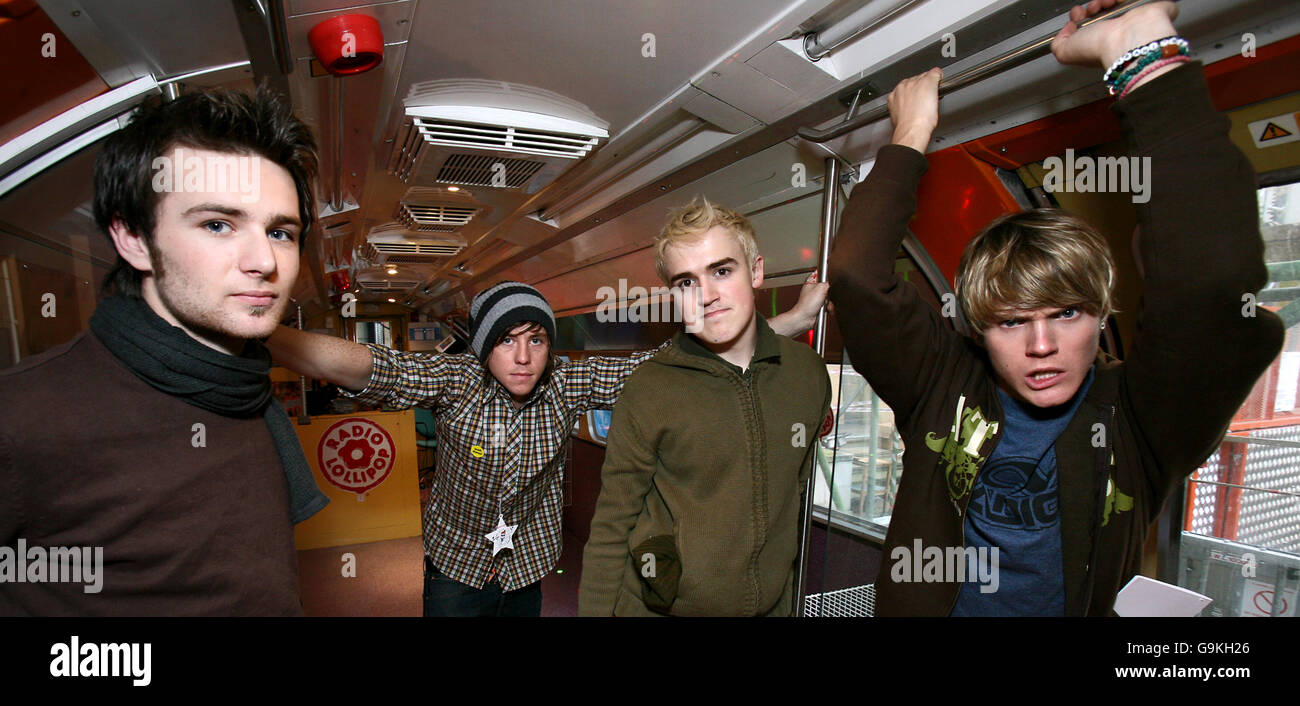 Members of McFly (left to right) Harry Judd, Danny Jones, Tom Fletcher and Dougie Poynter during a visit to Great Ormond Street Children's Hospital in central London. Stock Photo