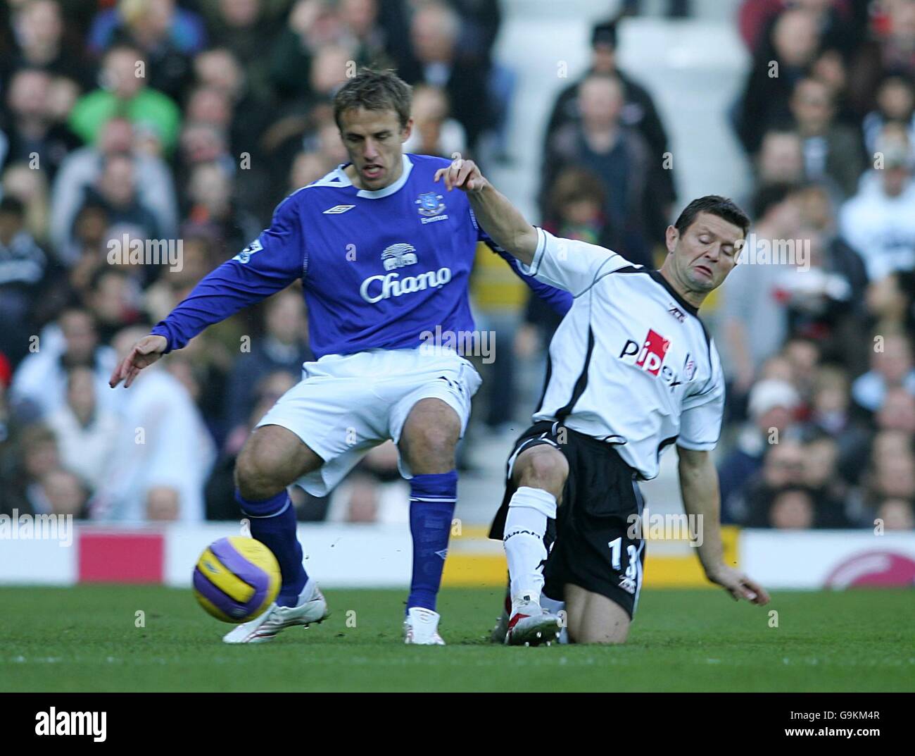 Soccer - FA Barclays Premiership - Fulham v Everton - Craven Cottage. Everton's Phil Neville and Fulham's Tomasz Radzinski battle for the ball Stock Photo