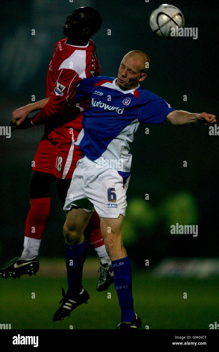 (L-R) Charlton Athletic's Jimmy Floyd Hasselbaink and Chesterfield's Derek Niven battle for the ball Stock Photo