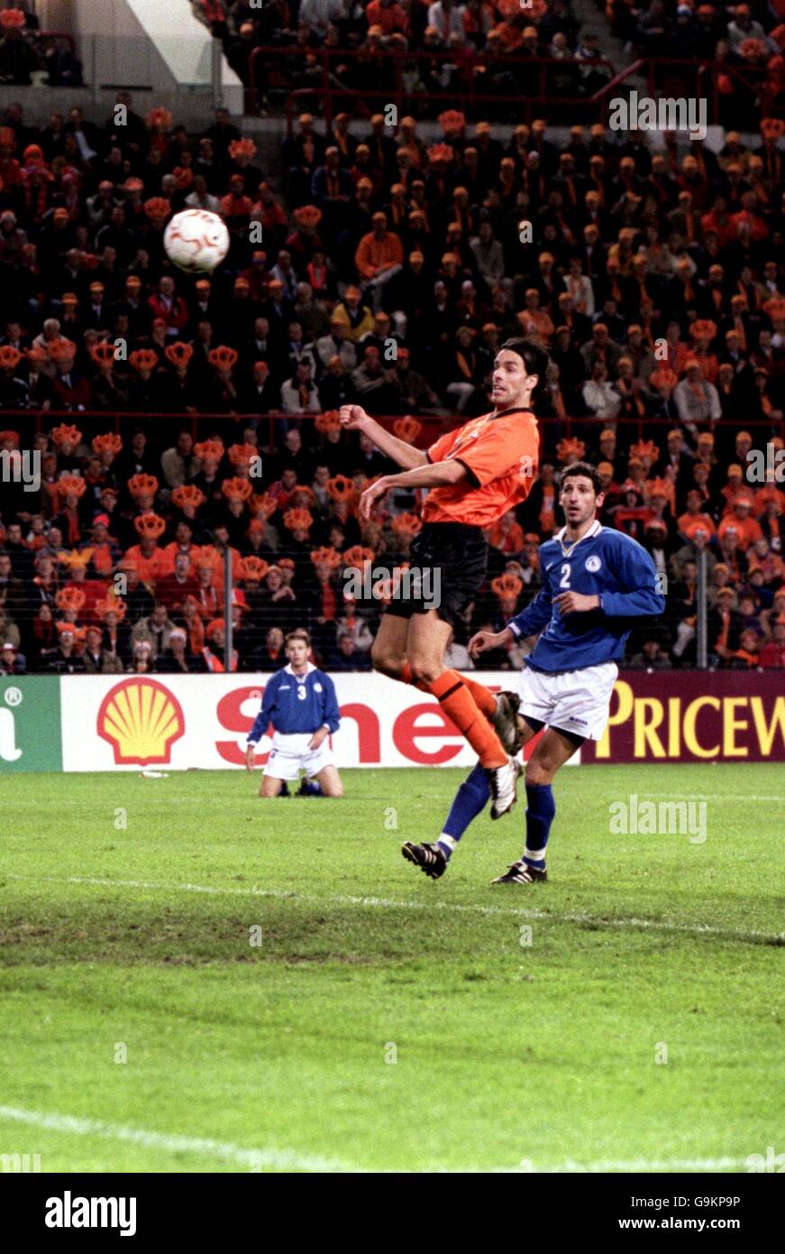 Holland's Ruud Van Nistelrooy scores Holland's fourth goal against Cyprus after being left unmarked by Petros Konnafis (R) Stock Photo