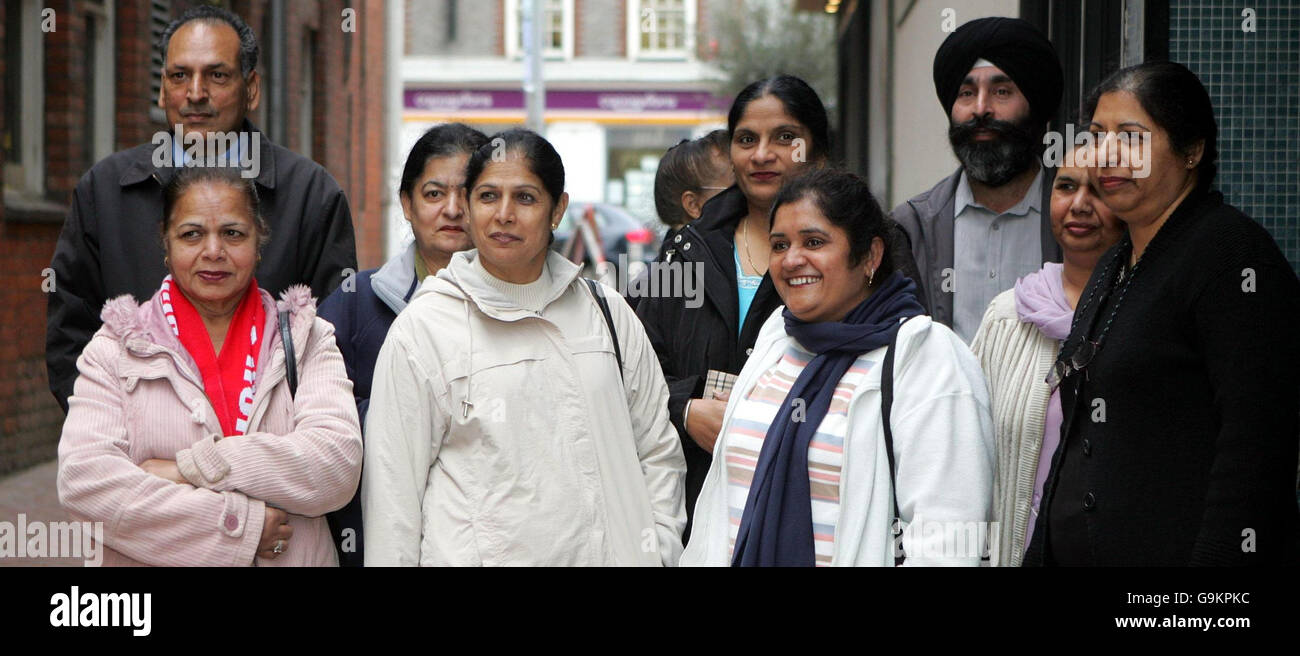 Parmjit Bains, (front row third from right) a former employee of Gate Gourmet and spokeswoman with other former workers as they arrived at the Reading employment tribunal. More than 100 catering workers whose dismissal led to travel chaos at Heathrow Airport. Stock Photo