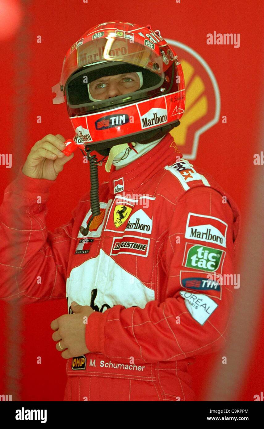 Michael Schumacher doesn't seem to like what he sees as he studies the lap times during practice for the Spanish Grand Prix Stock Photo