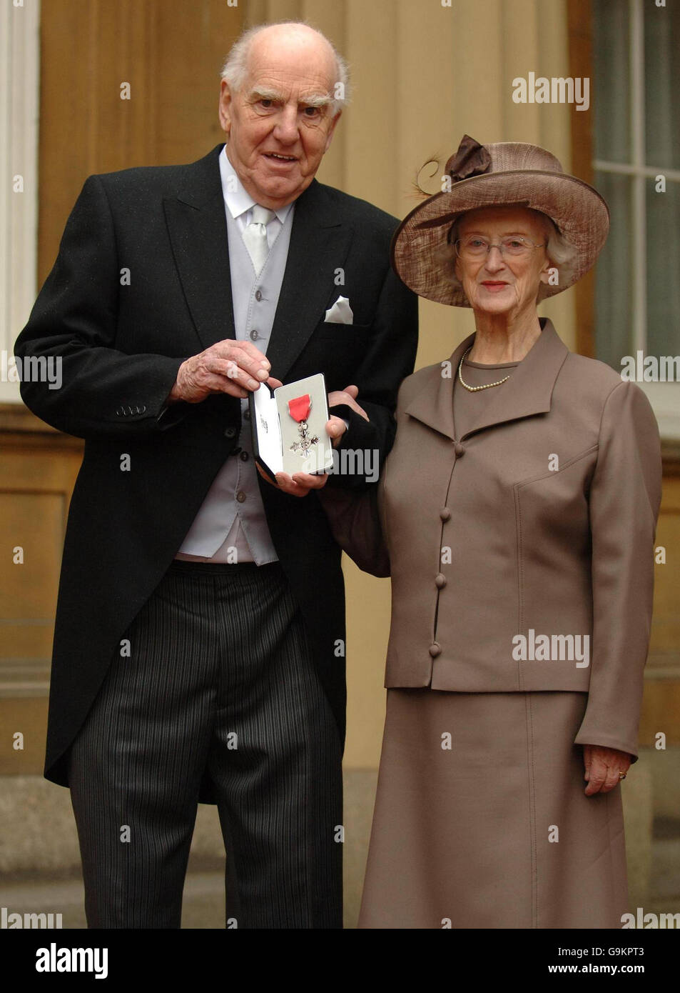 Mr Eric Lowe and wife Margaret with his MBE after collected it from the Queen Elizabeth II during an Investiture ceremony at Buckingham Palace, London. Stock Photo