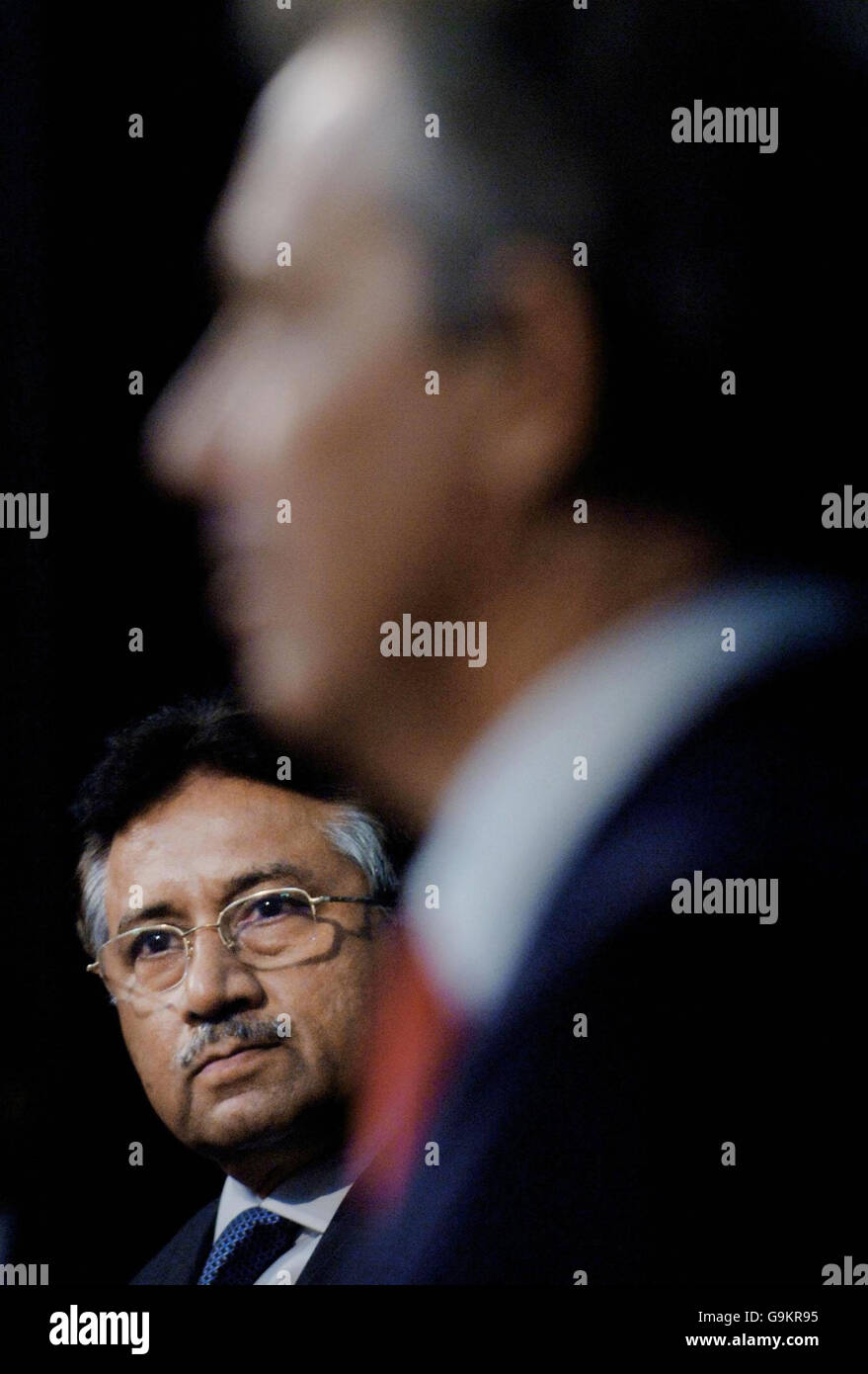Britain's Prime Minister Tony Blair hosts a joint news conference with Pakistani President Pervez Musharraf (left) at the Governor's Residence in Lahore. Stock Photo