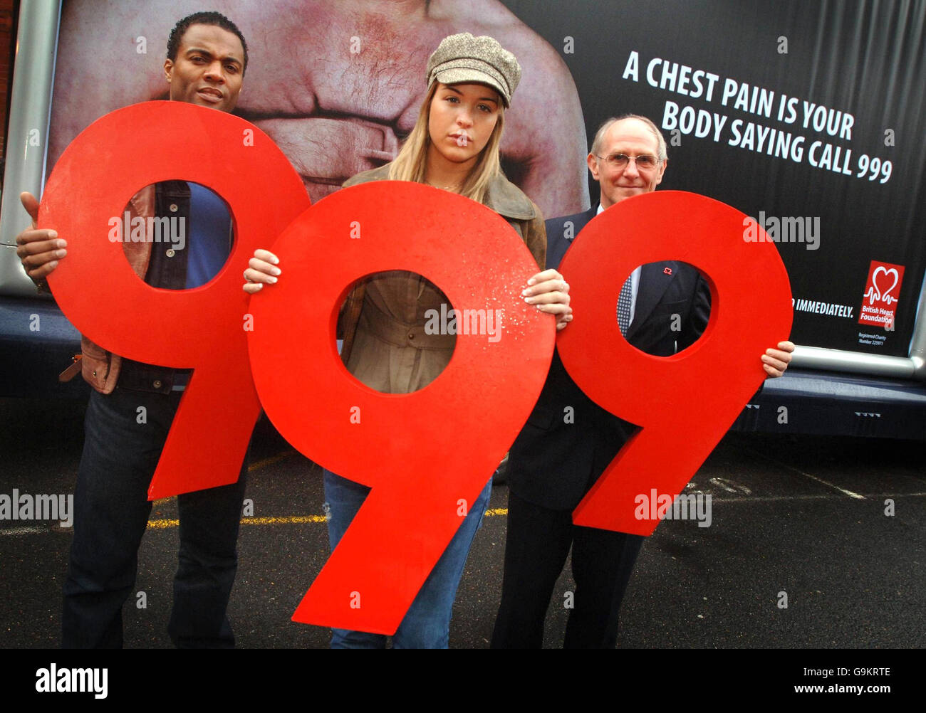 Actress Gemma Atkinson, actor Ray Fearon (left) and the Medical Director of the British Heart Foundation Professor Peter Weissberg gather at the London Chest Hospital to support the BHF' s poster campaign which encourages the public to phone 999 first if they suspect they are having a heart attack. Stock Photo