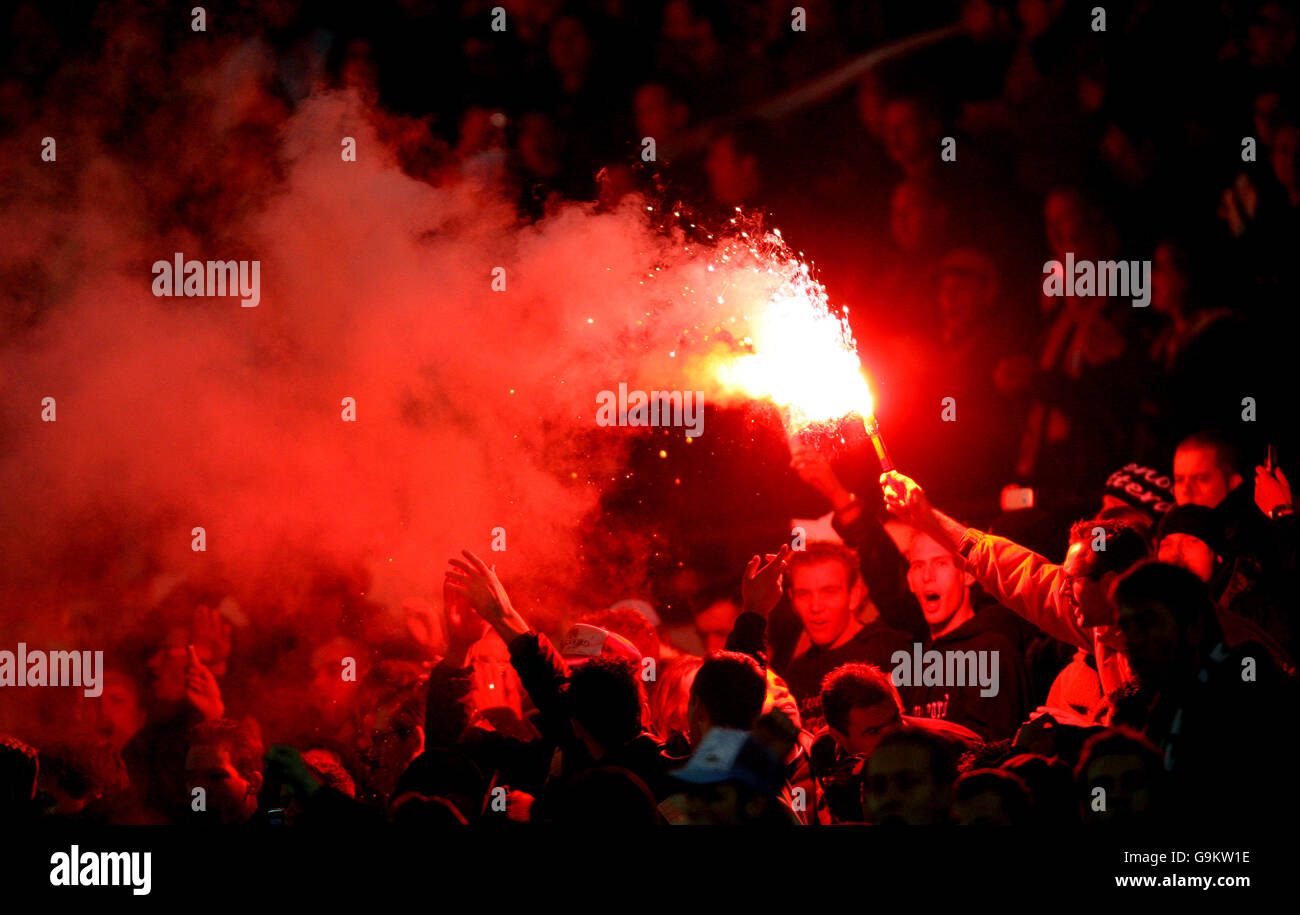 Soccer - UEFA Cup - Group E - Feyenoord v Blackburn Rovers - De Kuip Stadium. A flare goes off in the crowd Stock Photo