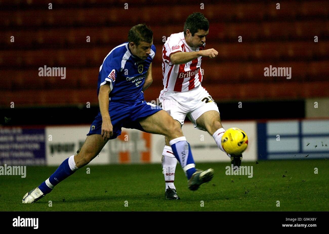 Paul Parry, Cardiff City and Andy Griffin, Stoke City battle for the ball Stock Photo