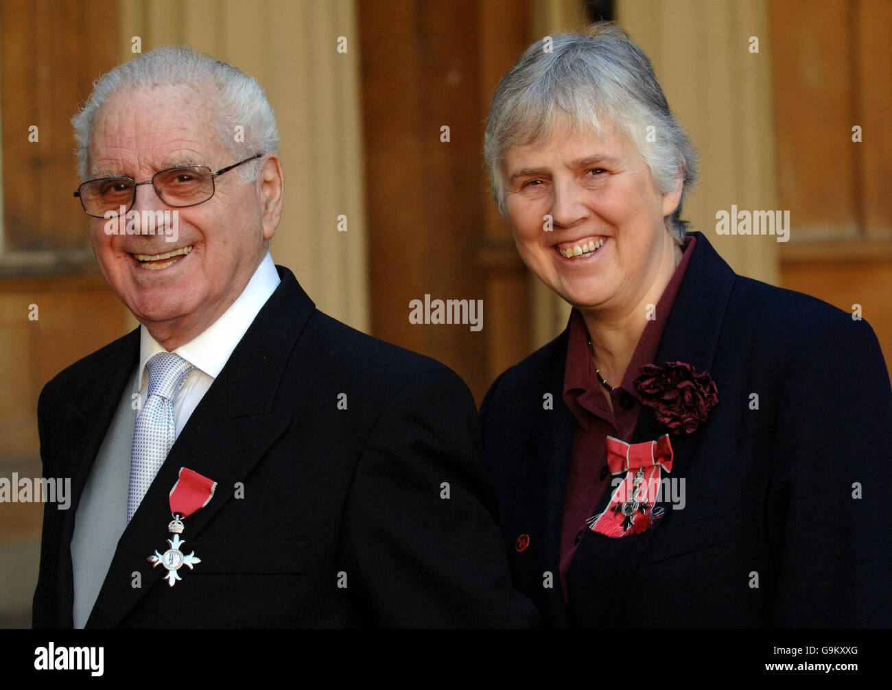 Victor Mizzi and Linda Walker, after each receiving MBE's for services to child victims of the Chernobyl disaster, in Belarus, from Queen Elizabeth II during an Investiture ceremony at Buckingham Palace, London. Stock Photo