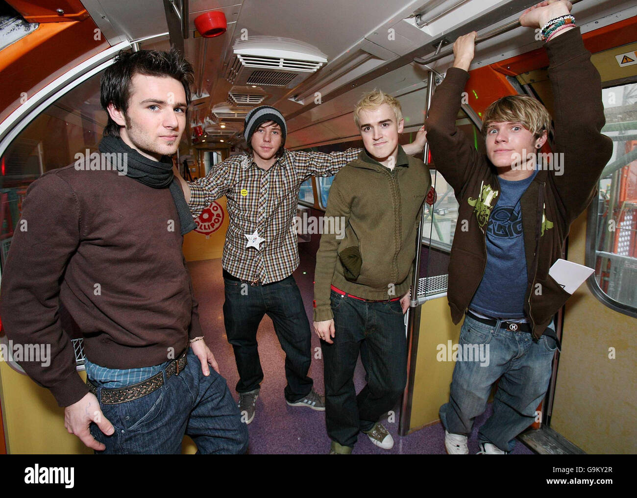 Members of McFly (left to right) Harry Judd, Danny Jones, Tom Fletcher and Dougie Poynter during a visit to Great Ormond Street Children's Hospital in central London. Stock Photo