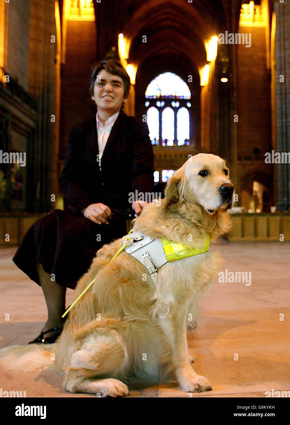 Maureen Rowley from Bristol with her guide dog Gus, who attended a mass at Liverpool Cathedral to celebrate 75 years of the Guide Dogs for the Blind Association. Stock Photo