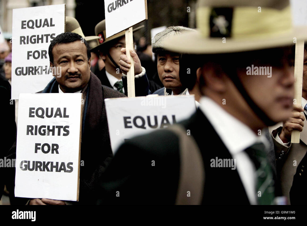 Gurkhas gather outside the House of Commons on their way to Downing Street, London, where they will demand equal rights. Stock Photo
