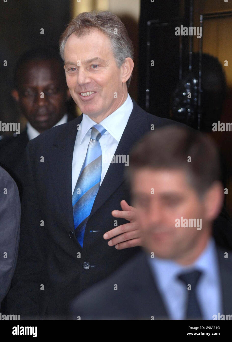 Britain's Prime Minister Tony Blair leaves 10 Downing Street, London, after police investigating the cash-for-honours affair questioned him. Stock Photo