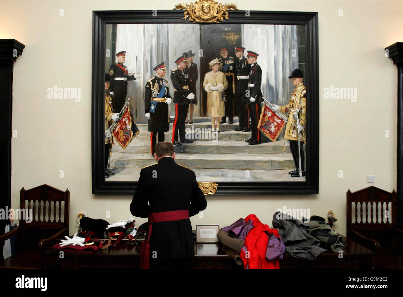 A group portrait of the Royal Family commemorating the commissioning of Prince Harry into the British Army by artist Sergei Pavlenko, hangs on the wall at Sandhurst. Stock Photo