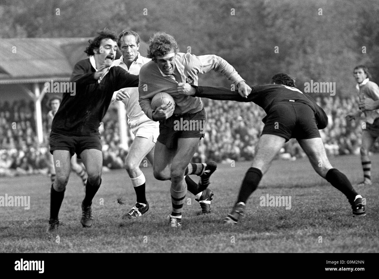 Rugby Union - Tour Match - Oxford University v Australia - Iffley Road. Australia's Greg Cornelsen (c) tries to break a tackle Stock Photo