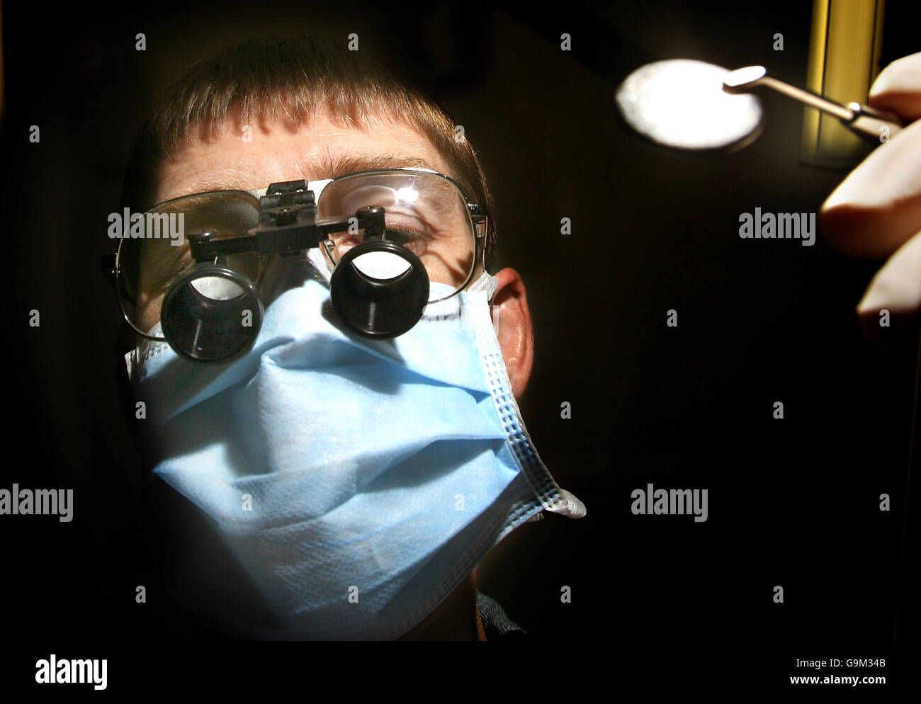 Private Dentist Doctor Gregory Foster performs a routine checkup at