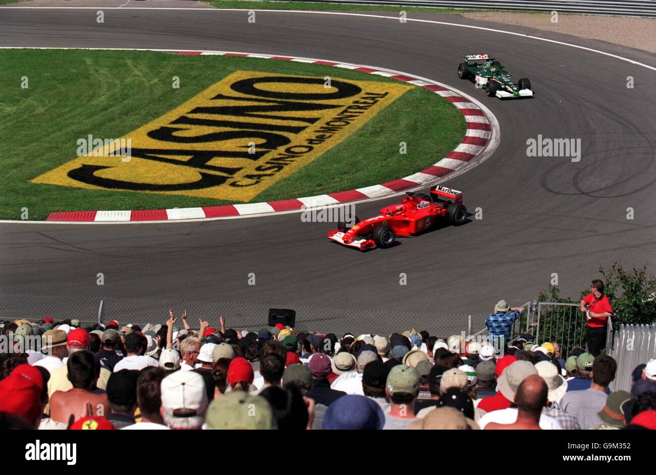 Formula One Motor Racing - Canadian Grand Prix - Qualifying. Ferrari's Michael Schumacher and Jaguar's Eddie Irvine take the hairpin Stock Photo