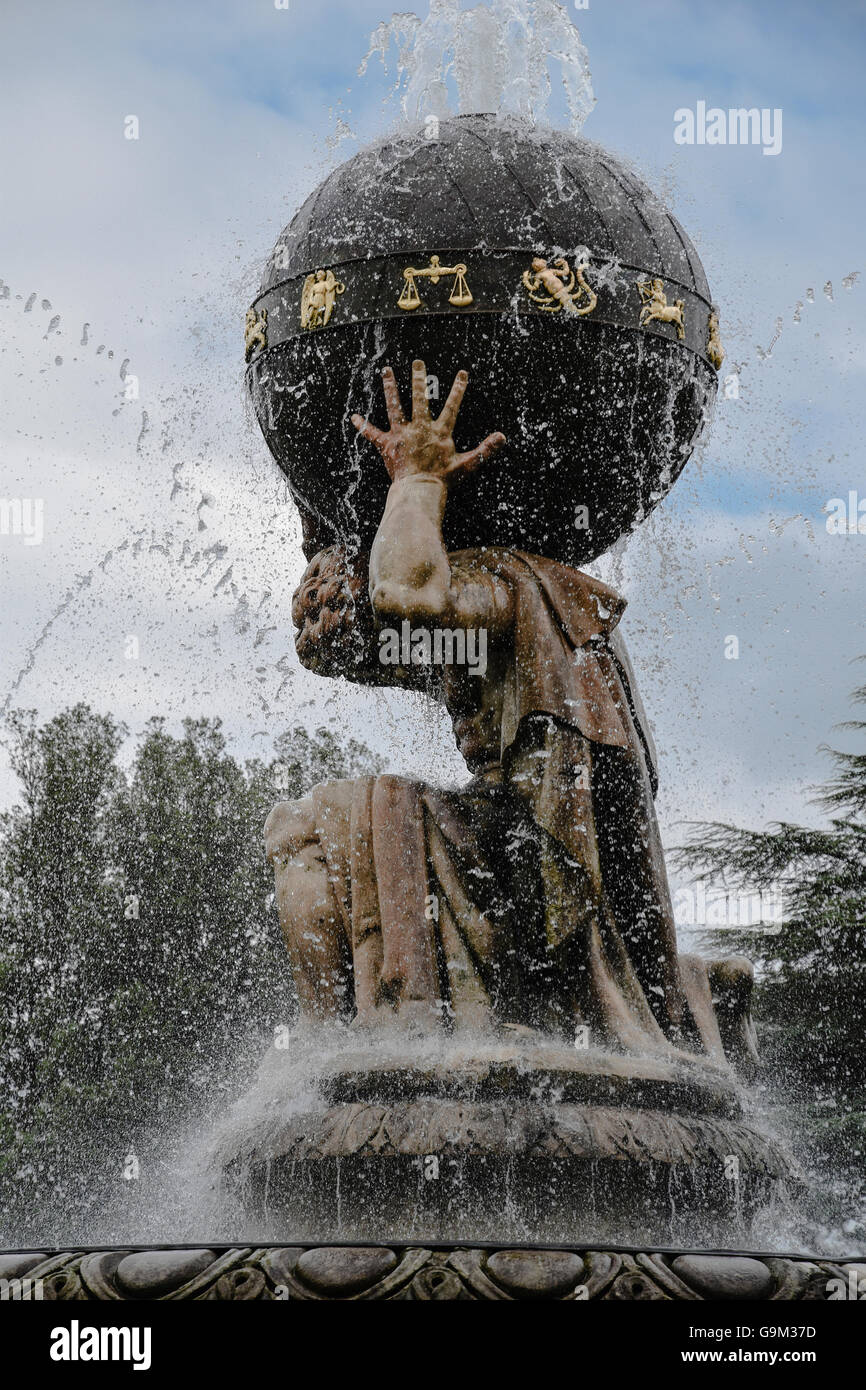 Atlas holding a Globe decorated with gold Zodiac Signs.  A close up view of The Atlas Fountain at Castle Howard. UK. Stock Photo