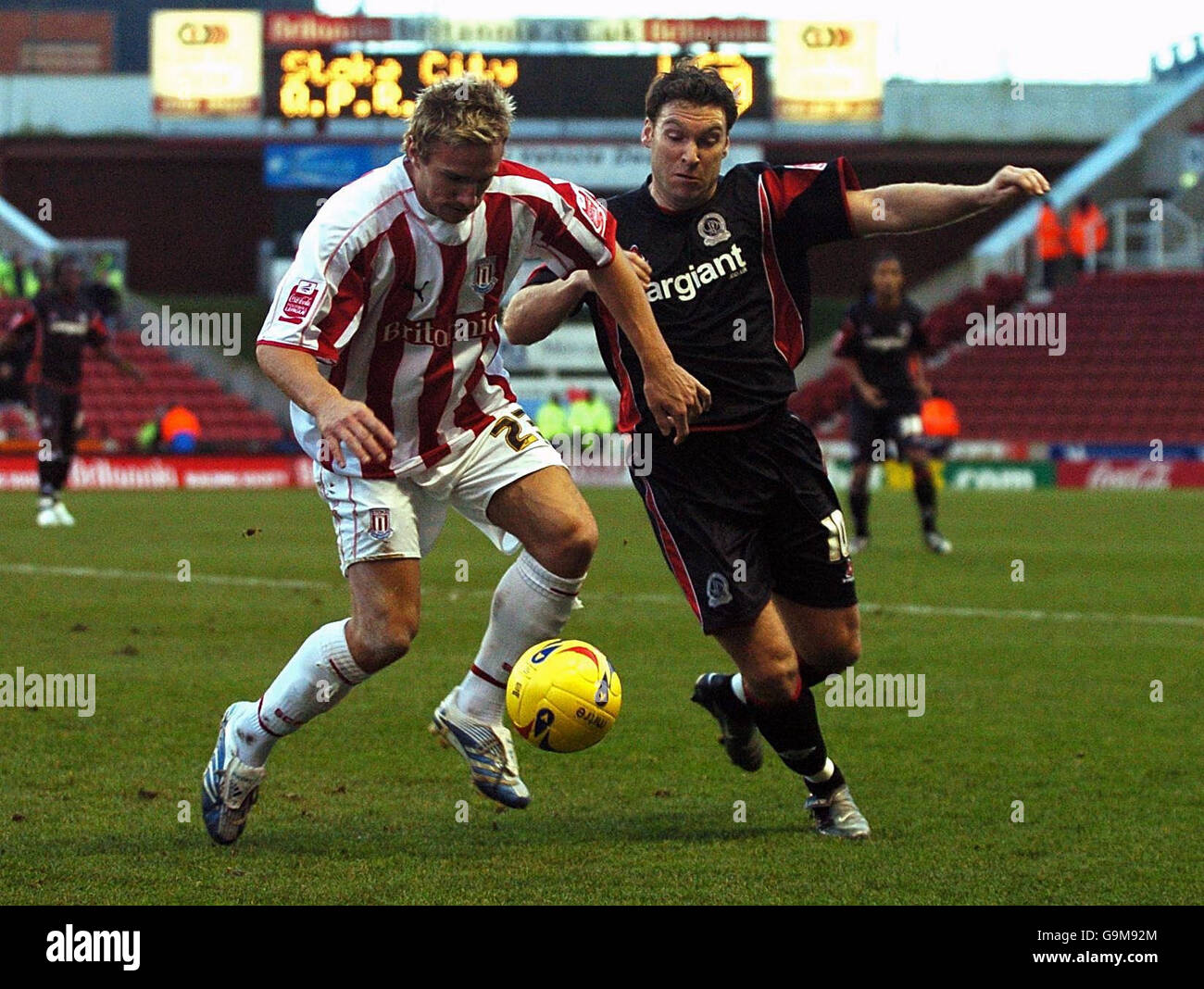 Stoke City's Liam Lawrence and Queens Park Rangers' Kevin Gallen during the Coca-Cola Championship match at the Britannia Stadium, Stoke. Stock Photo