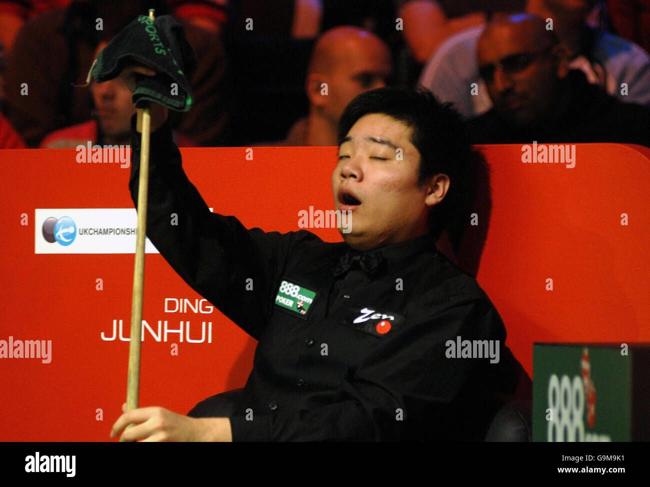 Current UK Snooker Champion Ding Junhui struggles to awake during his match against Ryan Day during the Maplin UK Snooker Championships the York Barbican Centre, York Stock Photo - Alamy